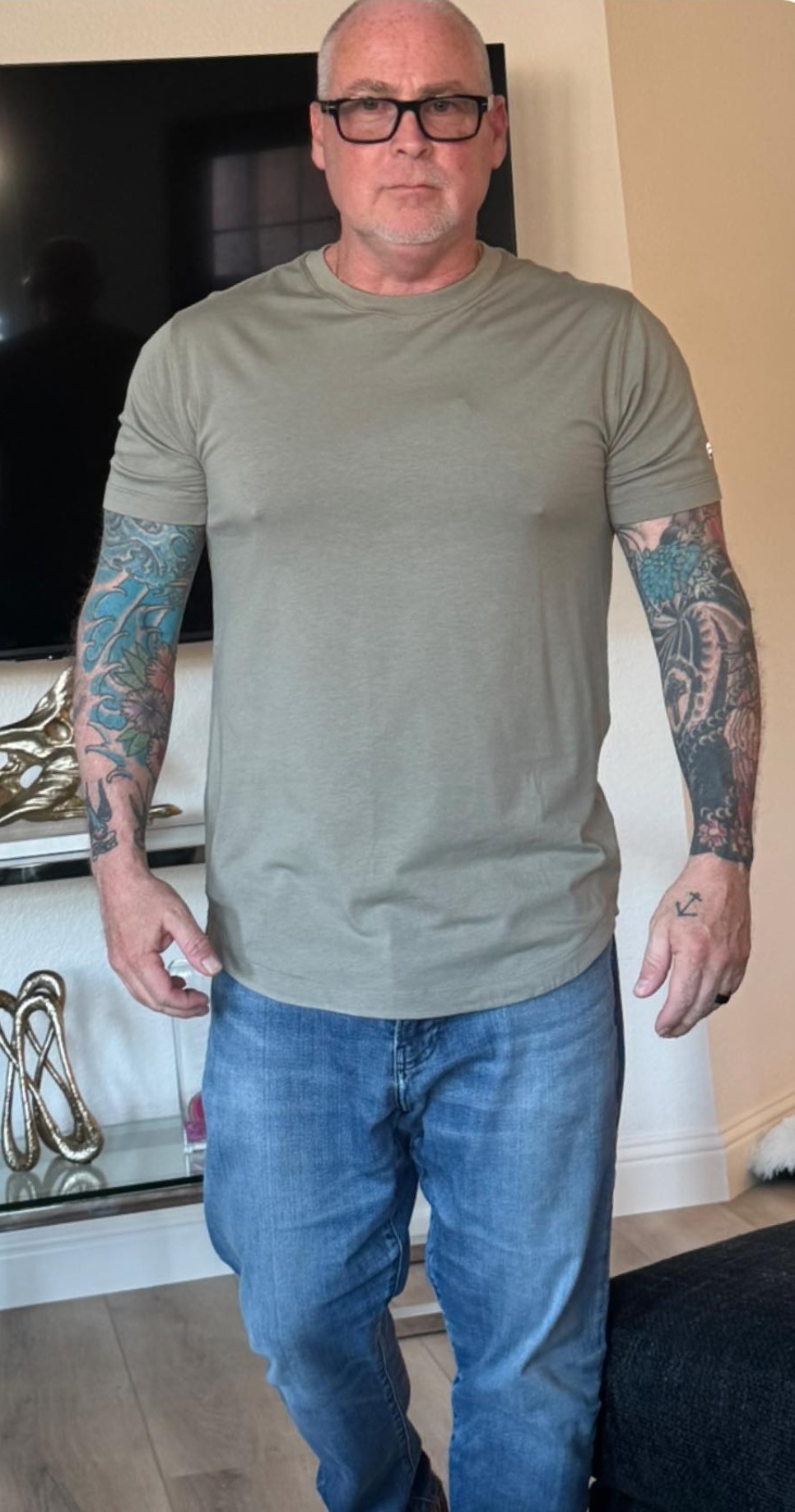 Brian — retired NYPD, tattoo sleeves, olive shirt